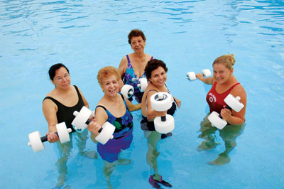 woman seniors at water aerobic class